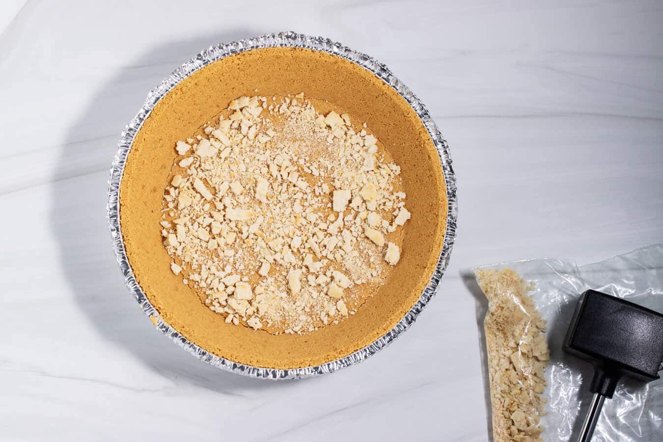 Premade graham cracker crust with crushed saltines in the bottom.