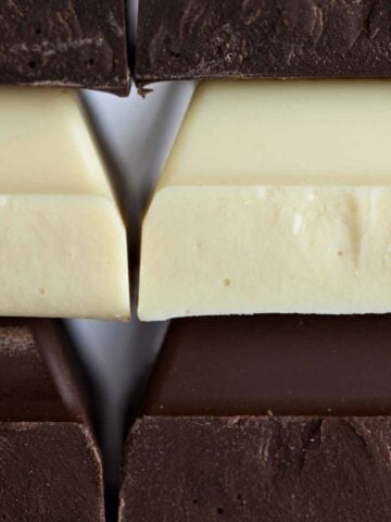 Stack of white and dark chocolate bars.