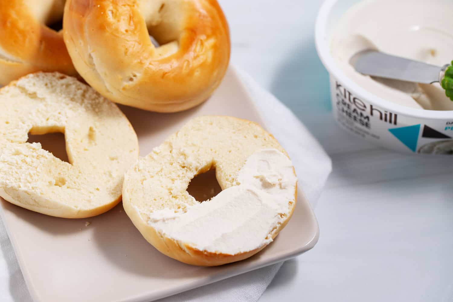 almond cream cheese spread on a bagel