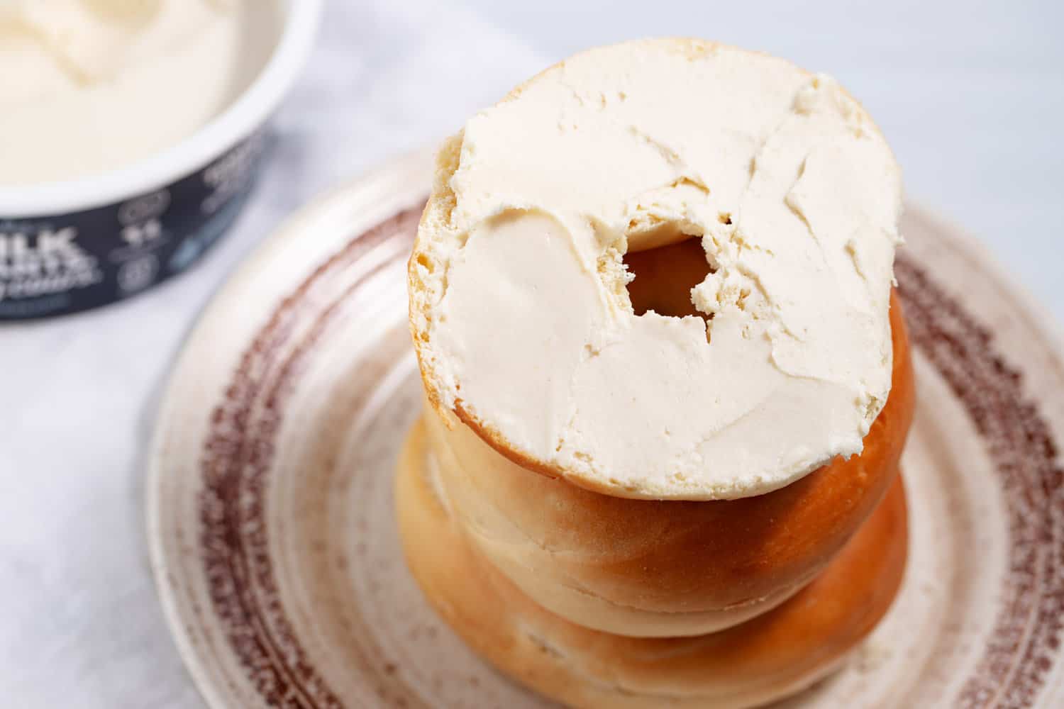 cashew cream cheese spread on a bagel