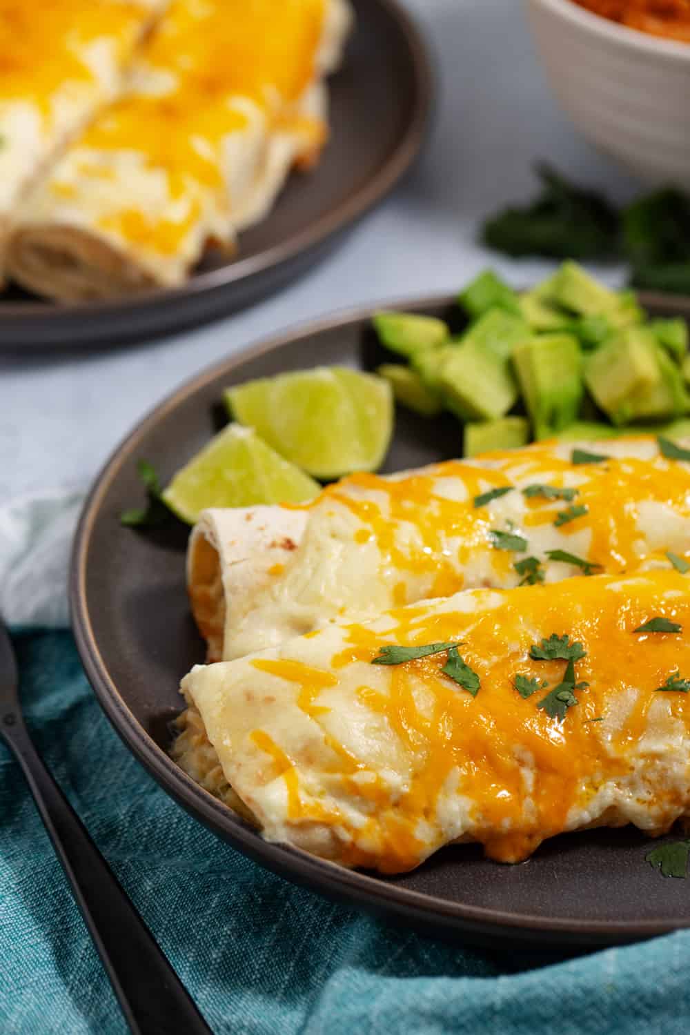 two chicken enchiladas with sour cream sauce