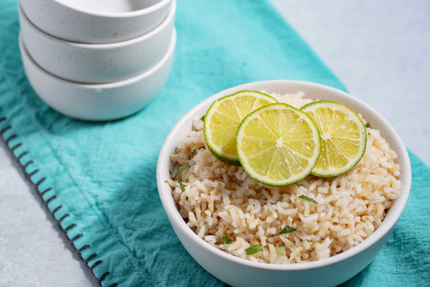 bowl of brown rice with lime slices