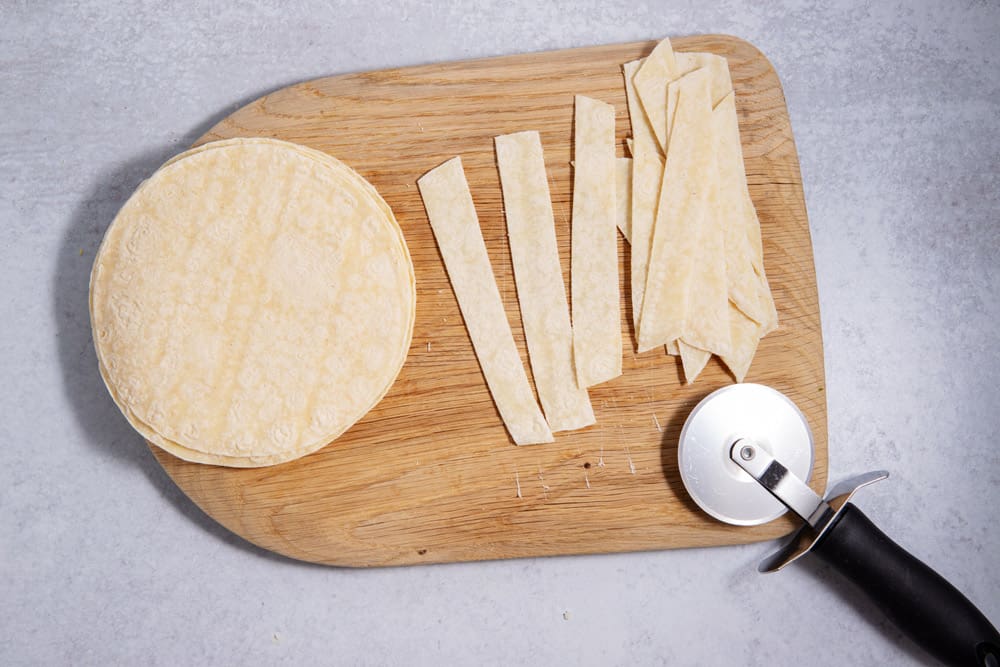 corn tortillas cut on cutting board