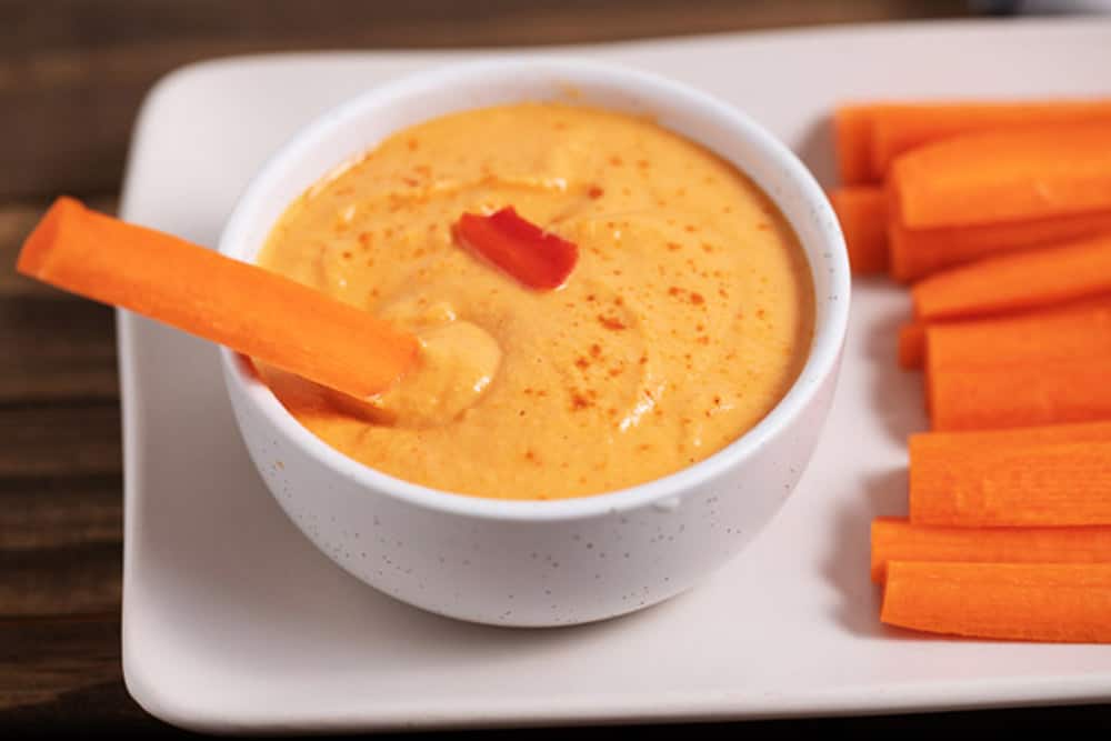 roasted red pepper hummus with carrot sticks