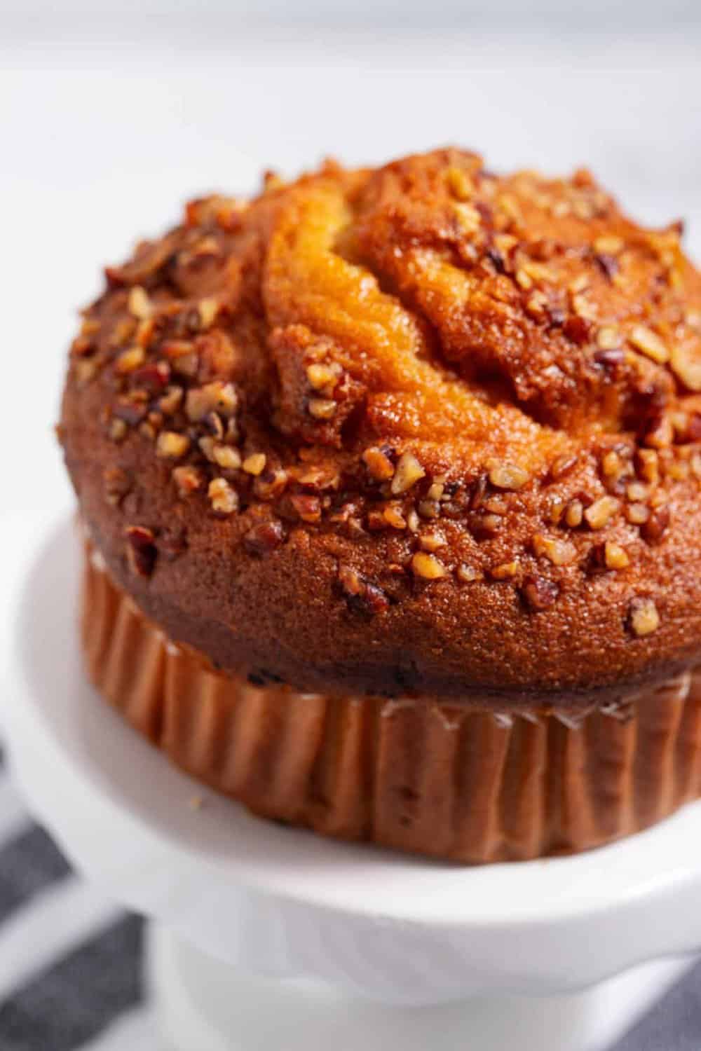 Jumbo bakery muffin with nut topping.