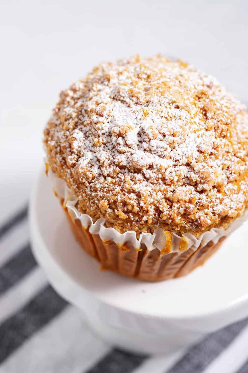 Bakery style muffin with powdered sugar.