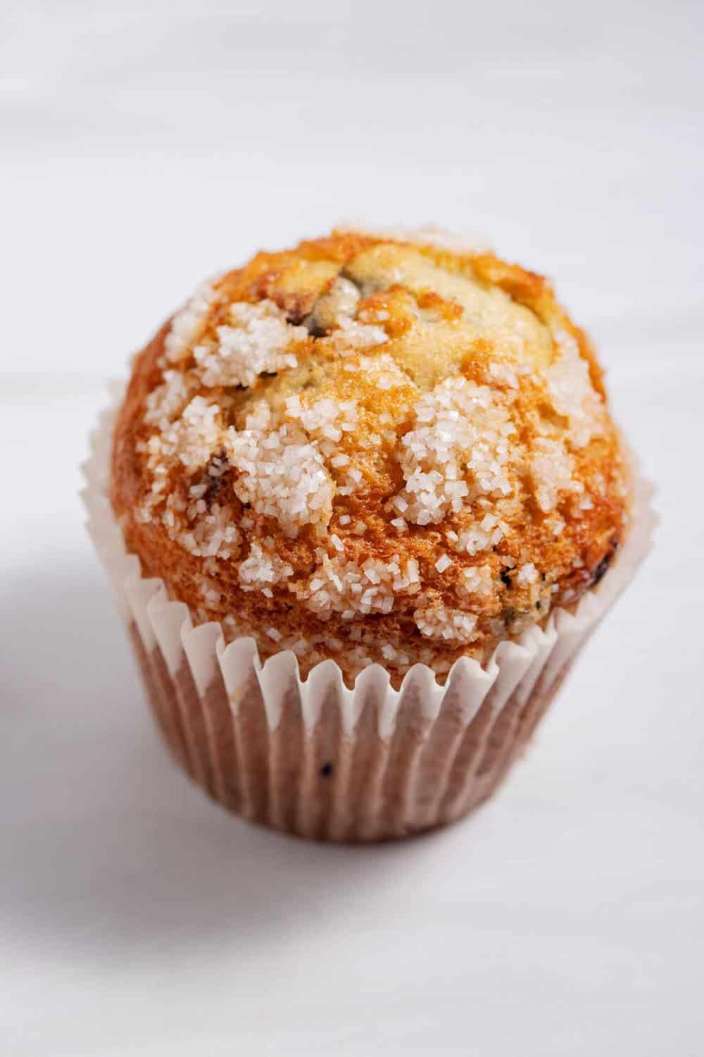 Bakery muffin with crunchy sugar topping.