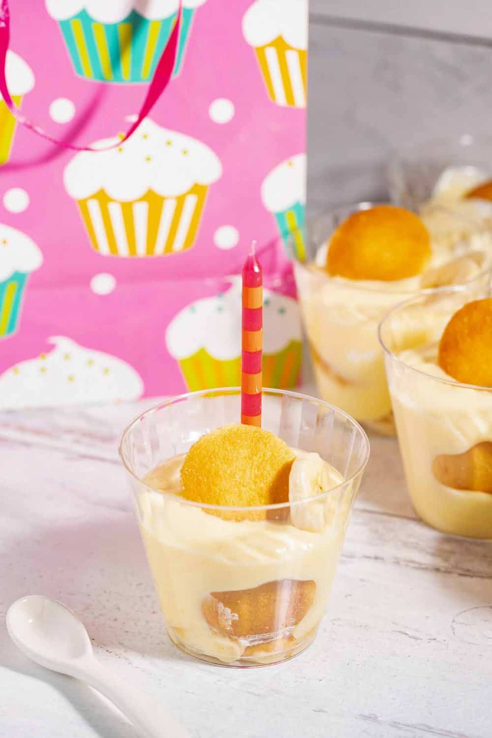 Banana pudding in plastic serving cups.