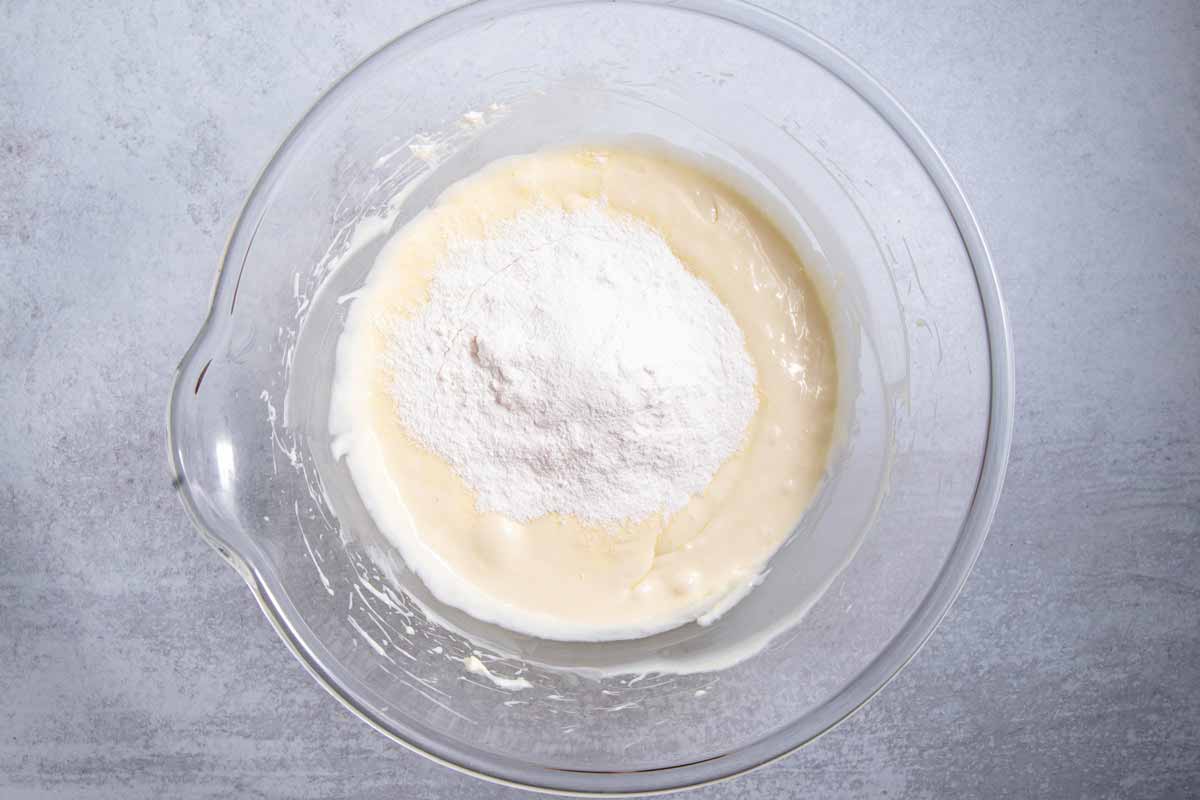 Mixing vanilla pudding mix into cream cheese for banana pudding
