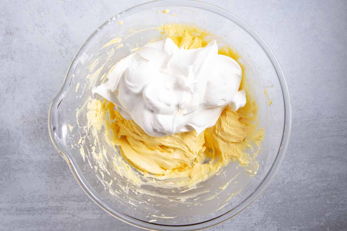mixing Cool Whip into cream cheese banana pudding