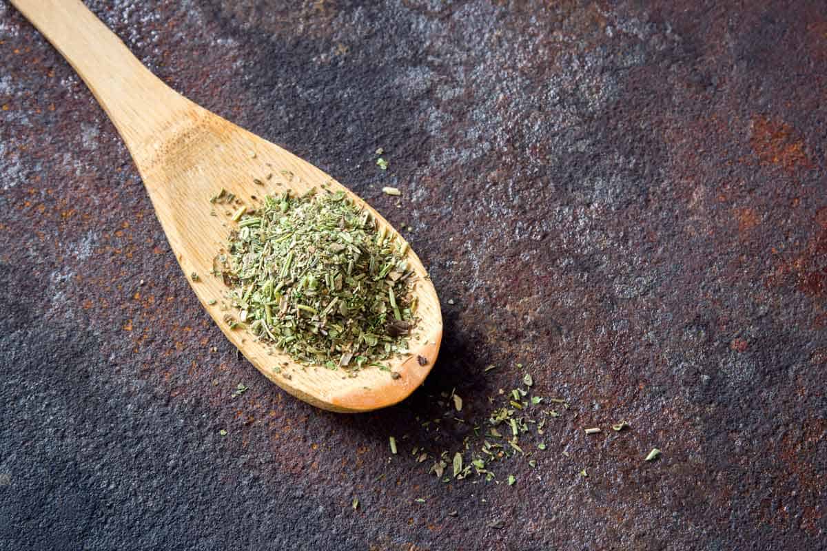 wooden spoon with dry herbs