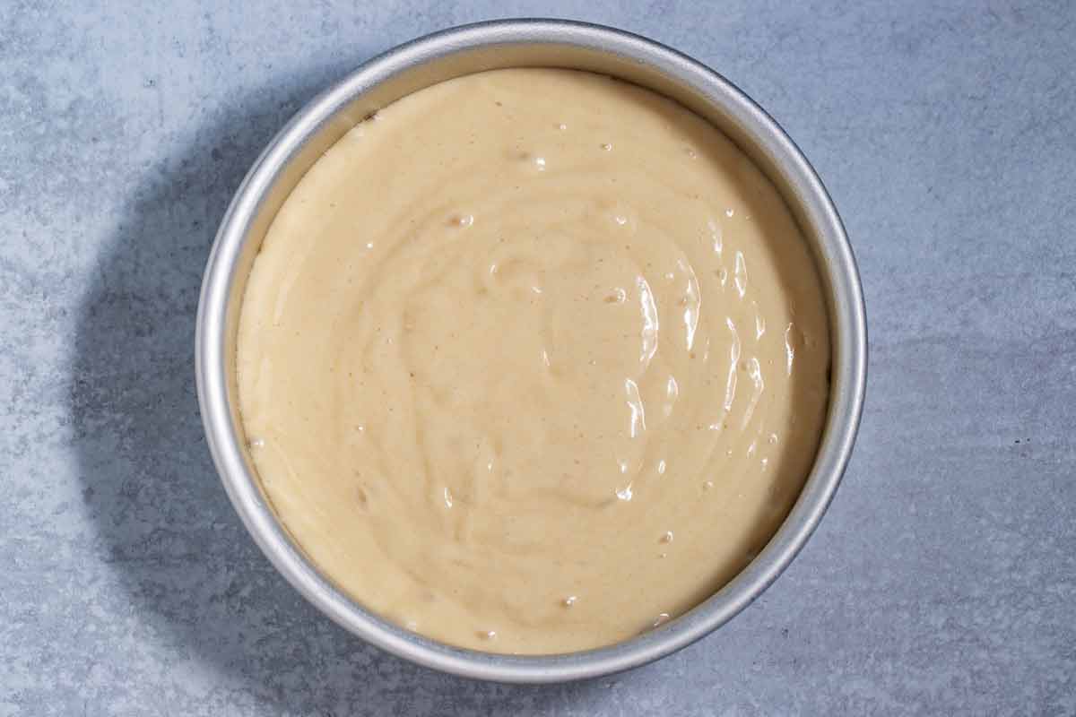 Cake batter in a cake pan.