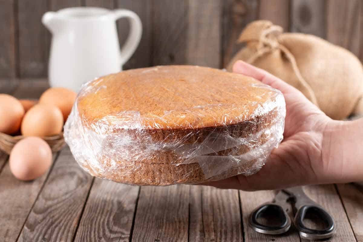Cake wrapped in plastic wrap to keep it fresh longer