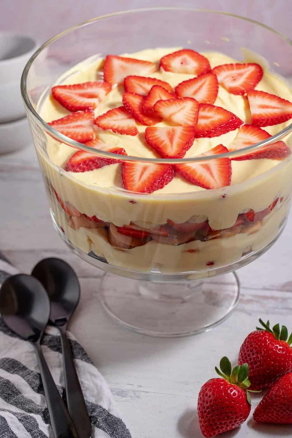 serving strawberry banana pudding in trifle dish