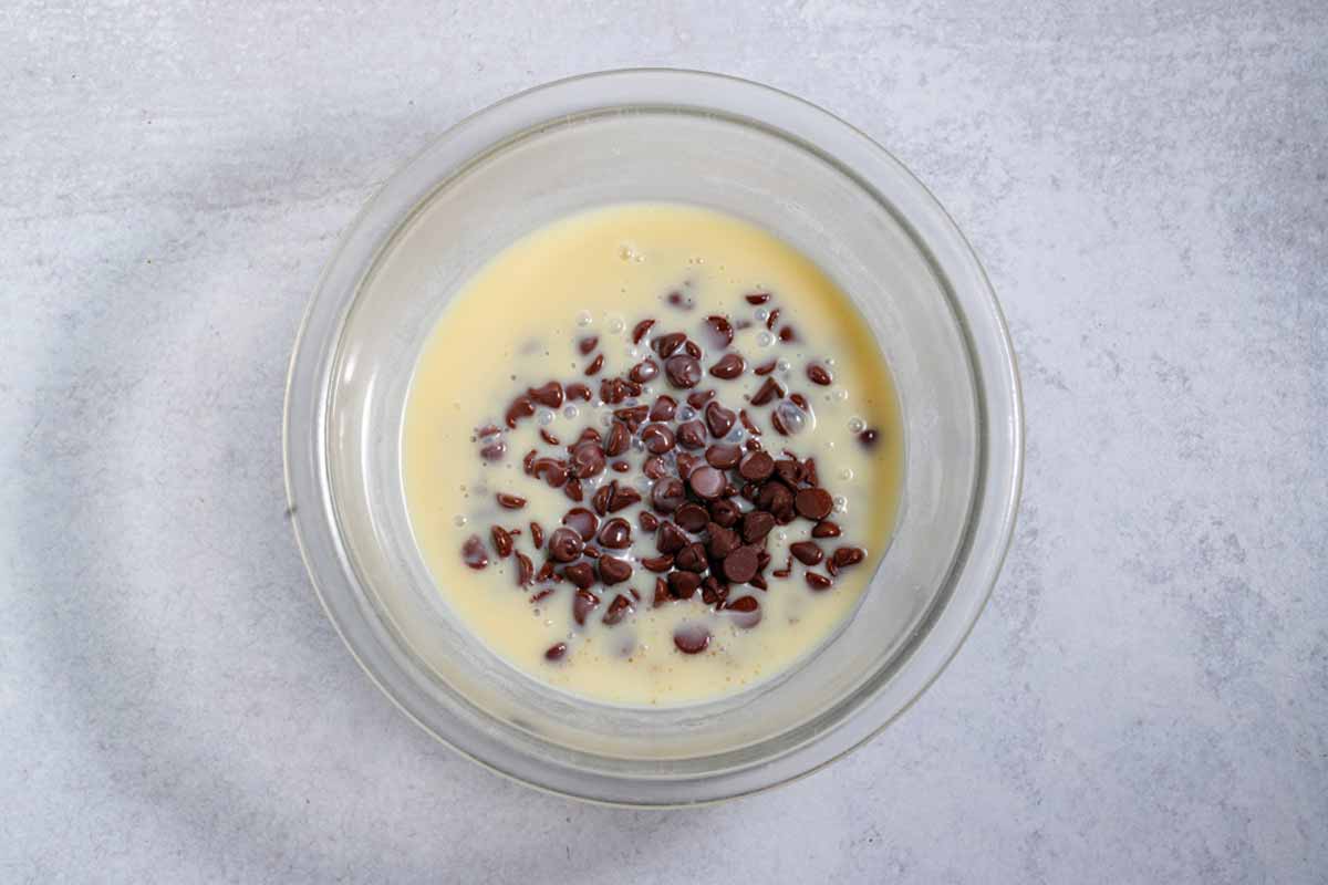 chocolate chips and sweetened condensed milk in a bowl