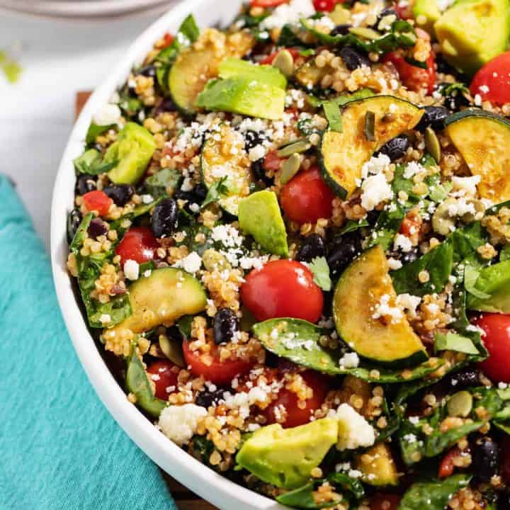 bowl of summer veggie quinoa black bean salad with lime dressing