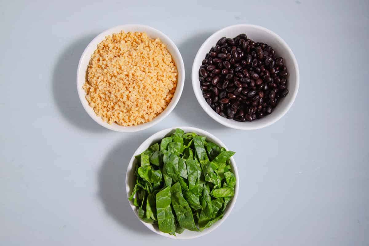 bowls of quinoa, black beans, and spinach