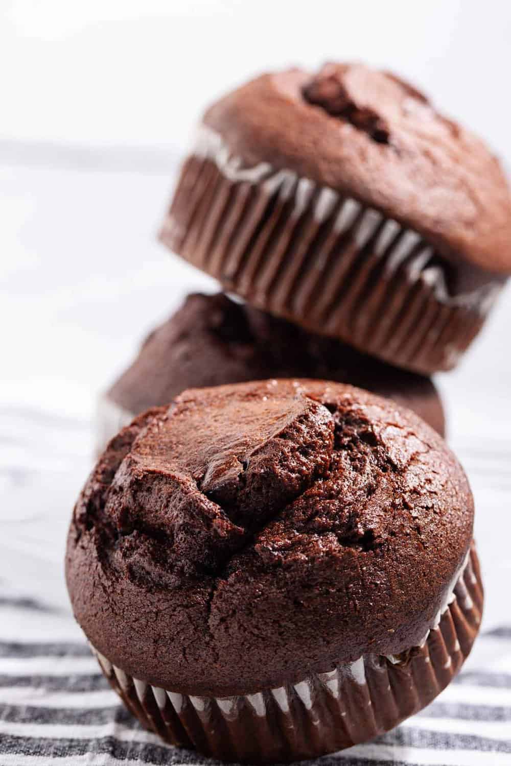 Stack of jumbo chocolate bakery muffins.