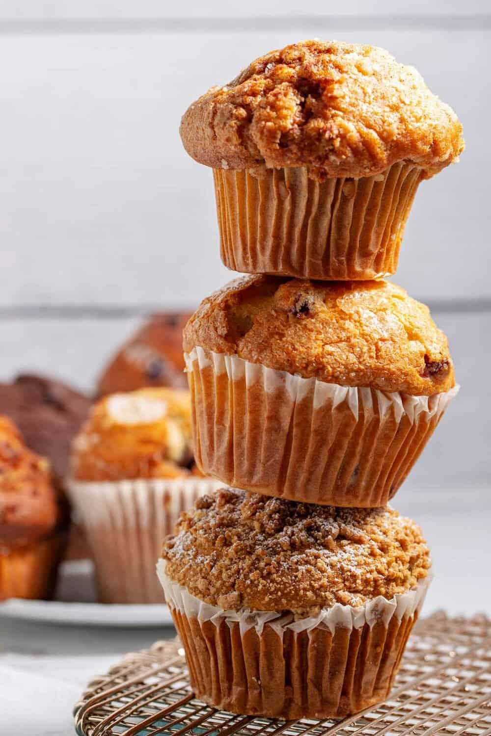 Stack of 3 bakery style muffins.