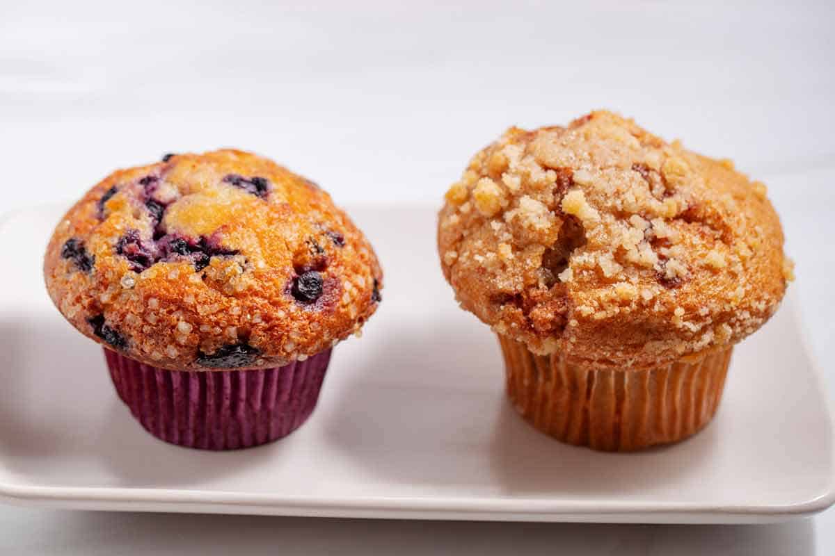 Side by side comparison of different bakery style muffins.