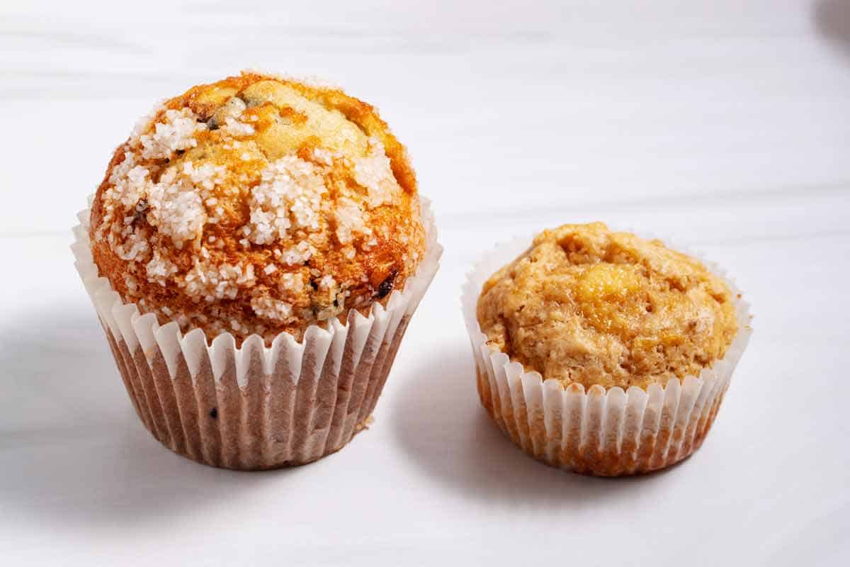 bakery muffin next to homemade muffin.