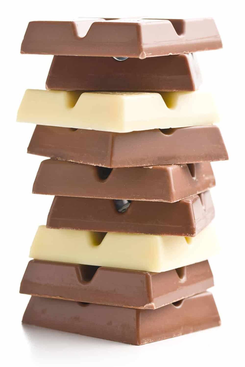 Stack of white and milk chocolate squares.