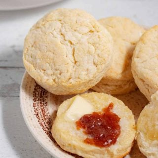 plate of pancake mix buttermilk biscuits with butter and jelly
