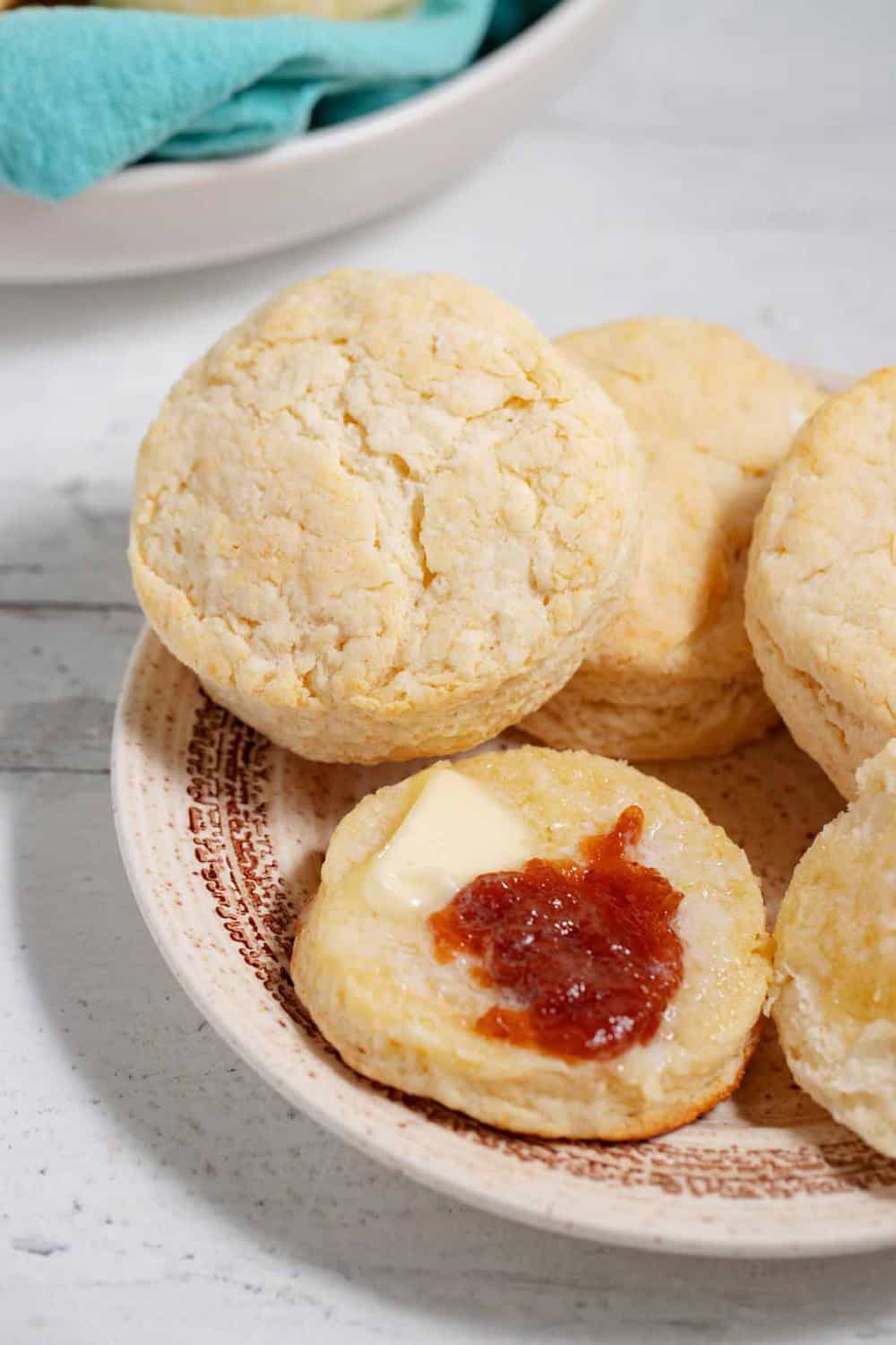 plate of pancake mix buttermilk biscuits with butter and jelly