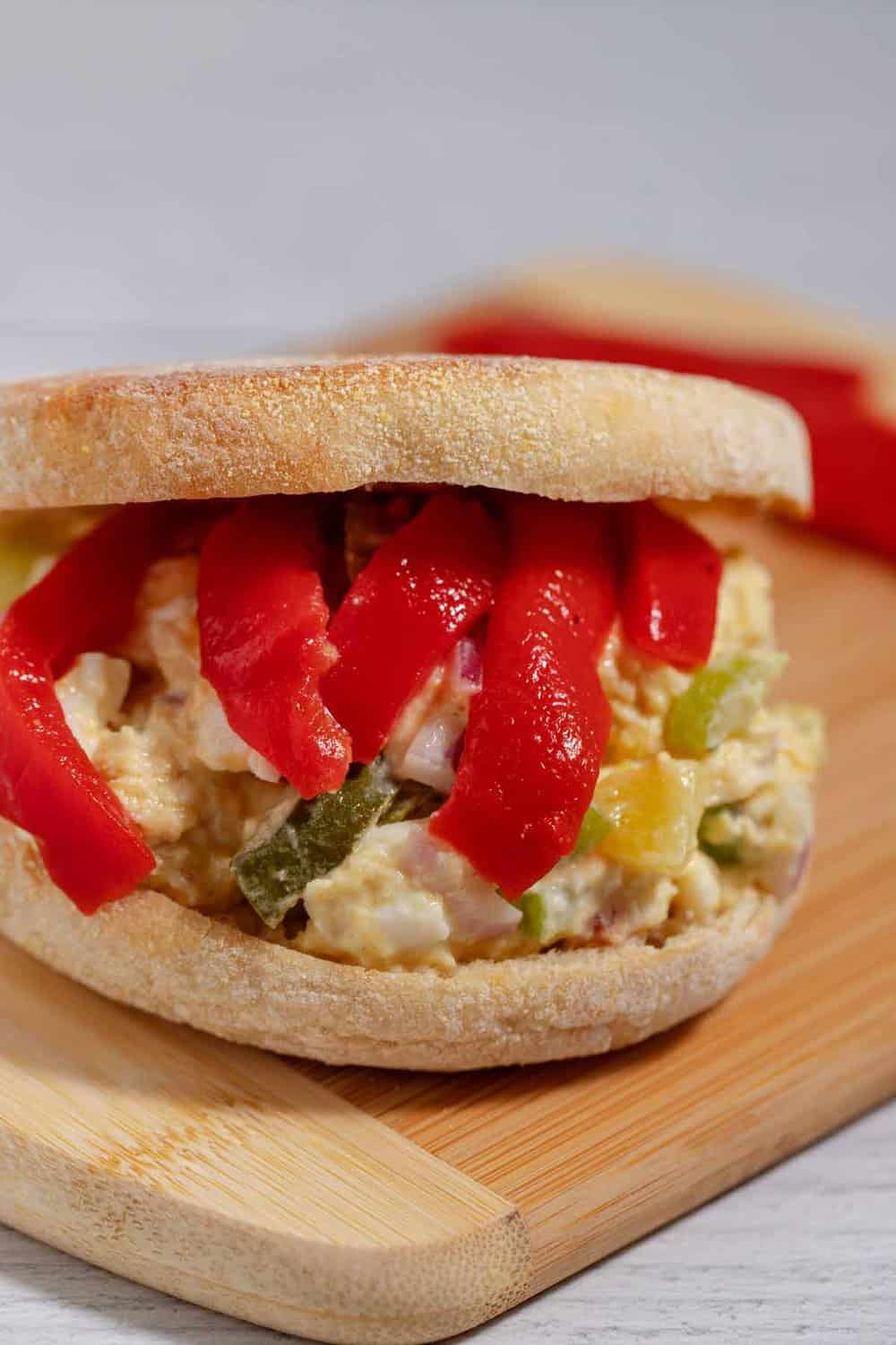 Roasted red peppers on a chicken salad sandwich.