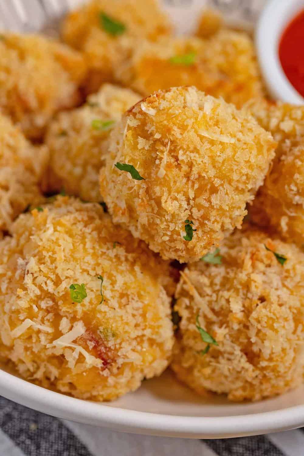 Mac and cheese balls on a plate.