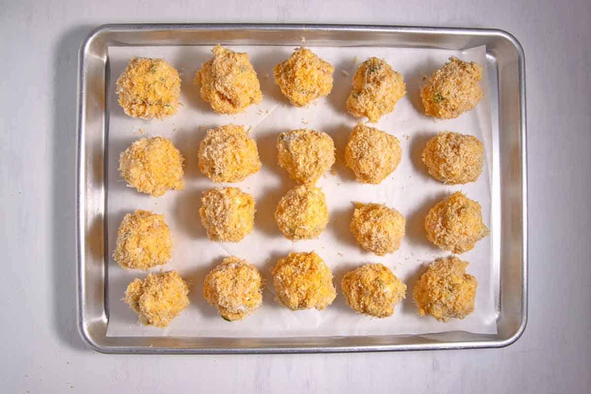 mac and cheese bites on a cookie sheet