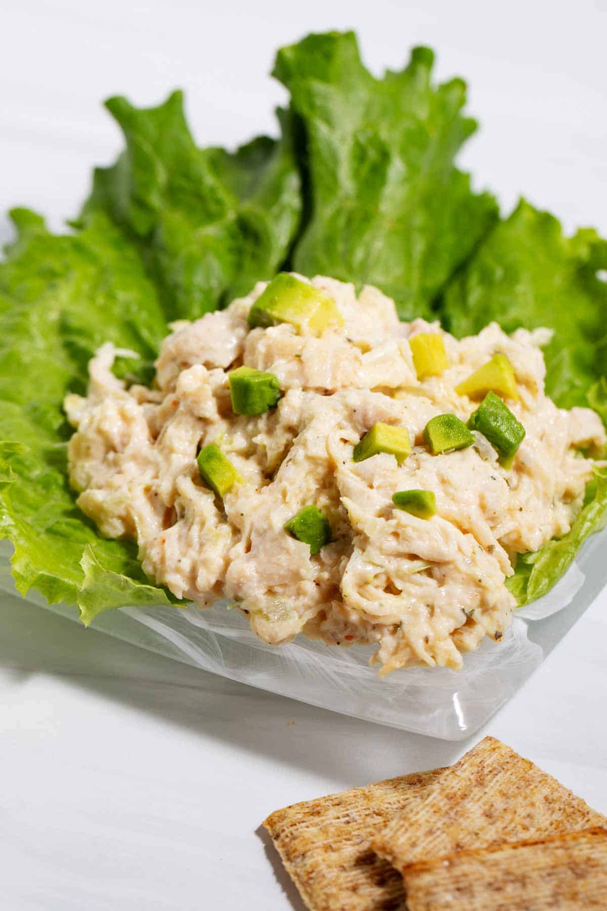 Avocado chunks in store-bought chicken salad to improve the taste.