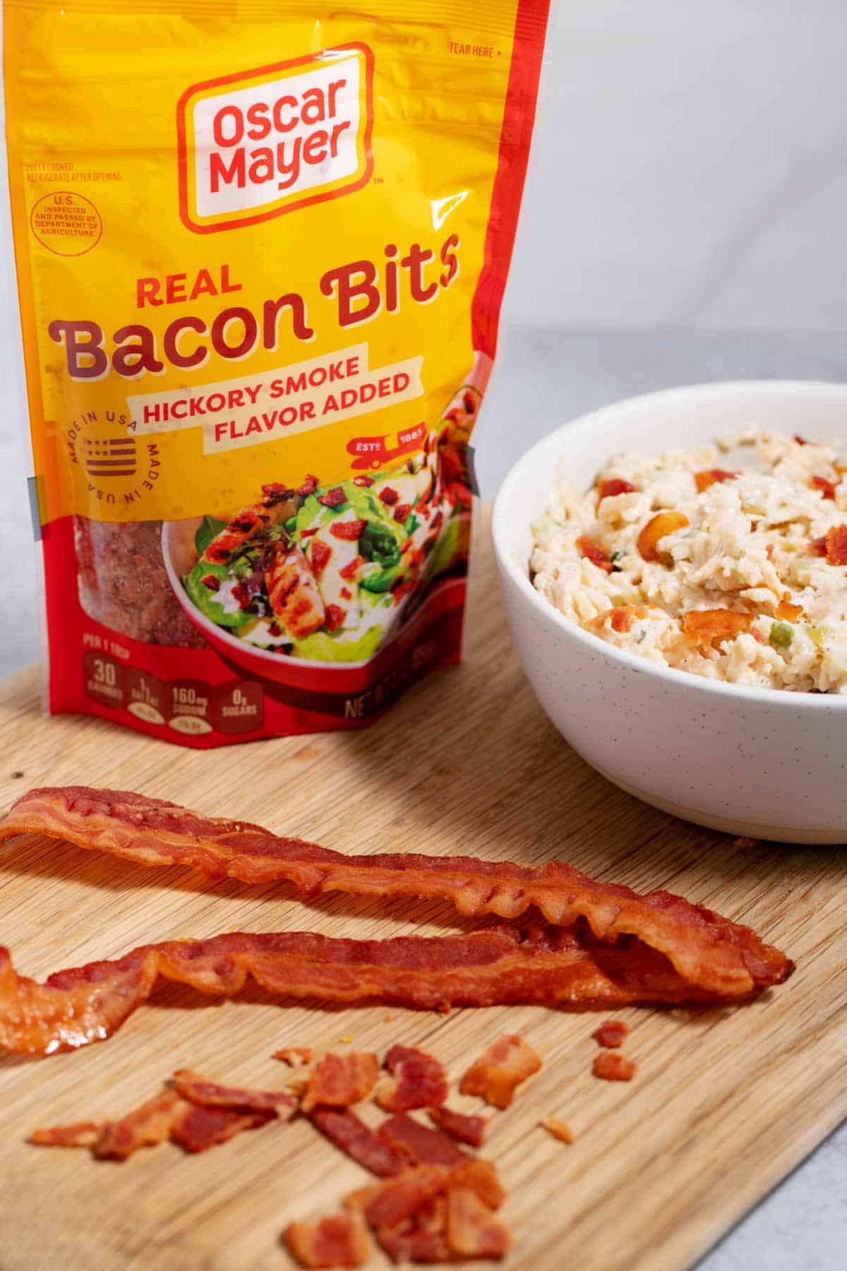 Crumbled bacon added to store-bought chicken salad to jazz it up.