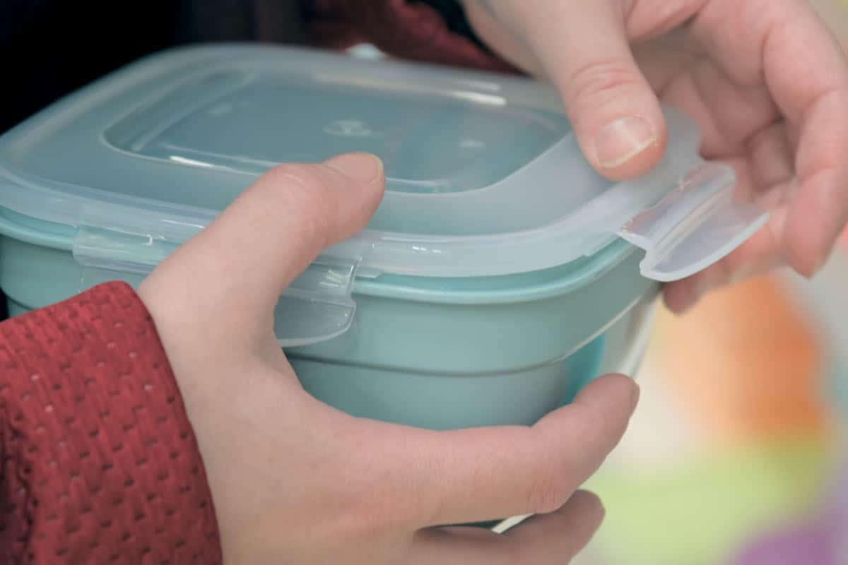 Plastic storage container to store leftover chicken salad.