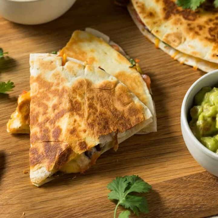 Quesadillas with a bowl of guacamole.
