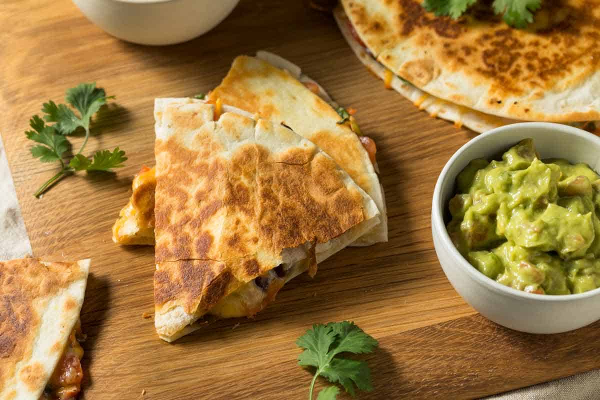 Quesadillas with a bowl of guacamole.