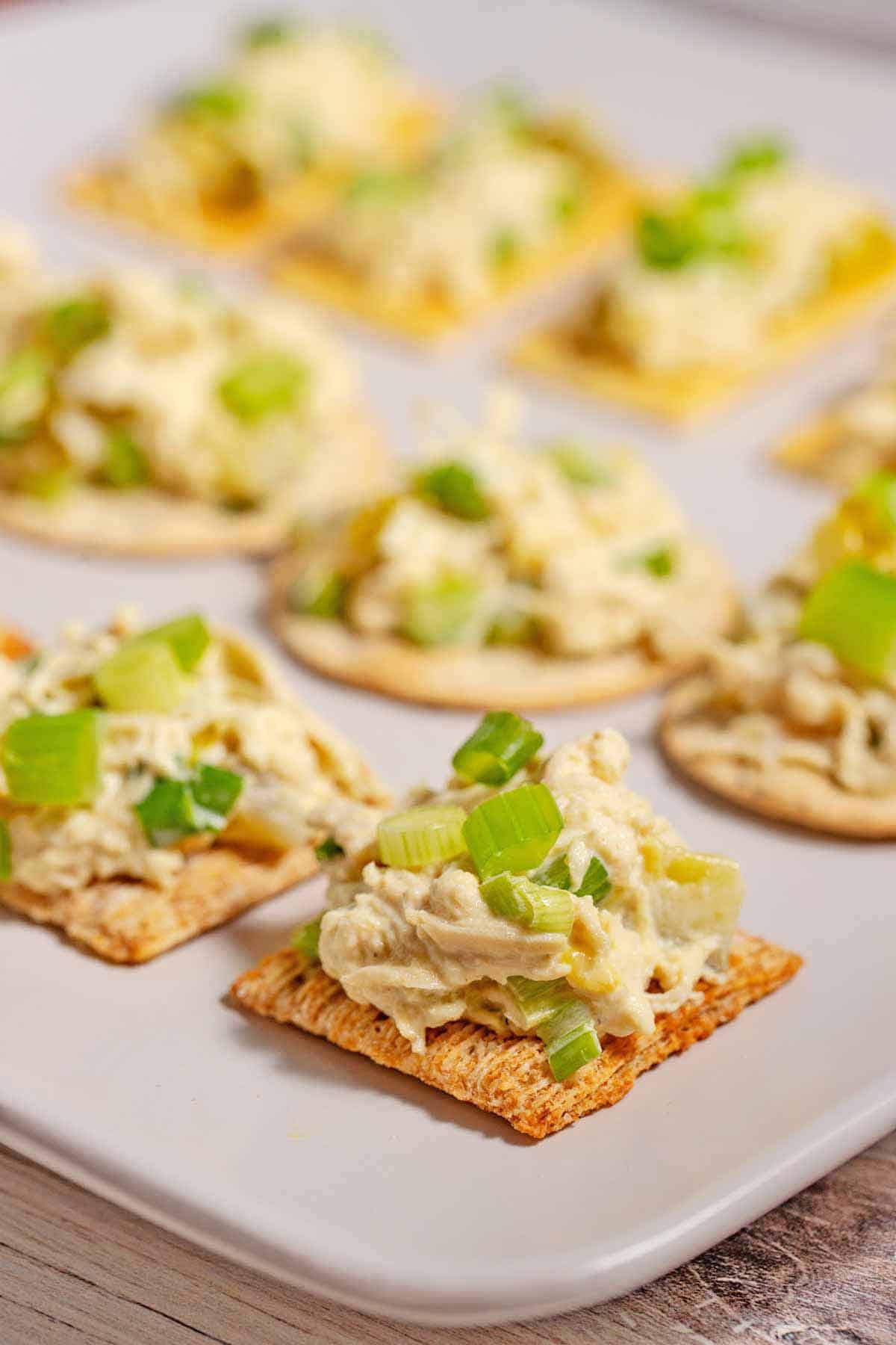 Plate of chicken salad cracker appetizers.