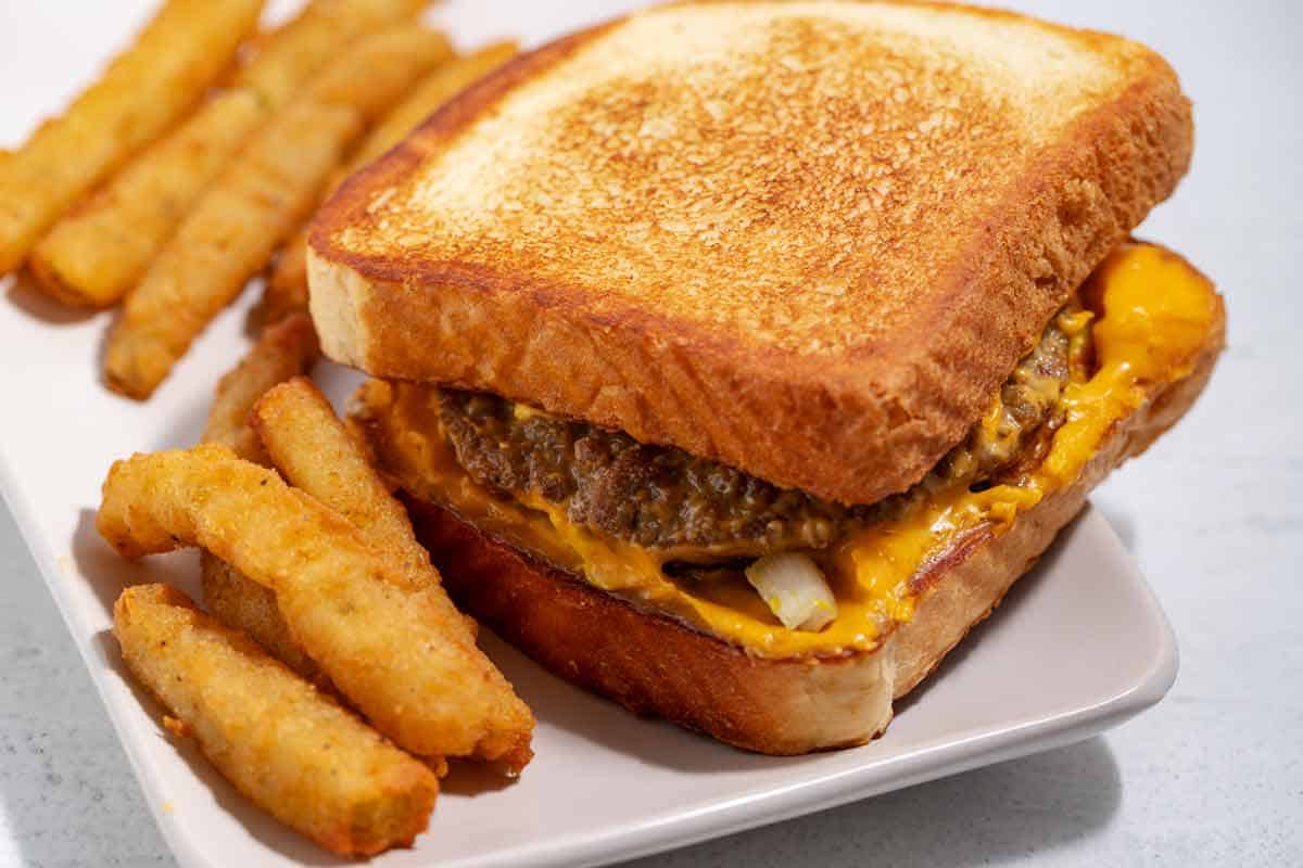 Cheeseburger served on Texas toast with pickle fries.
