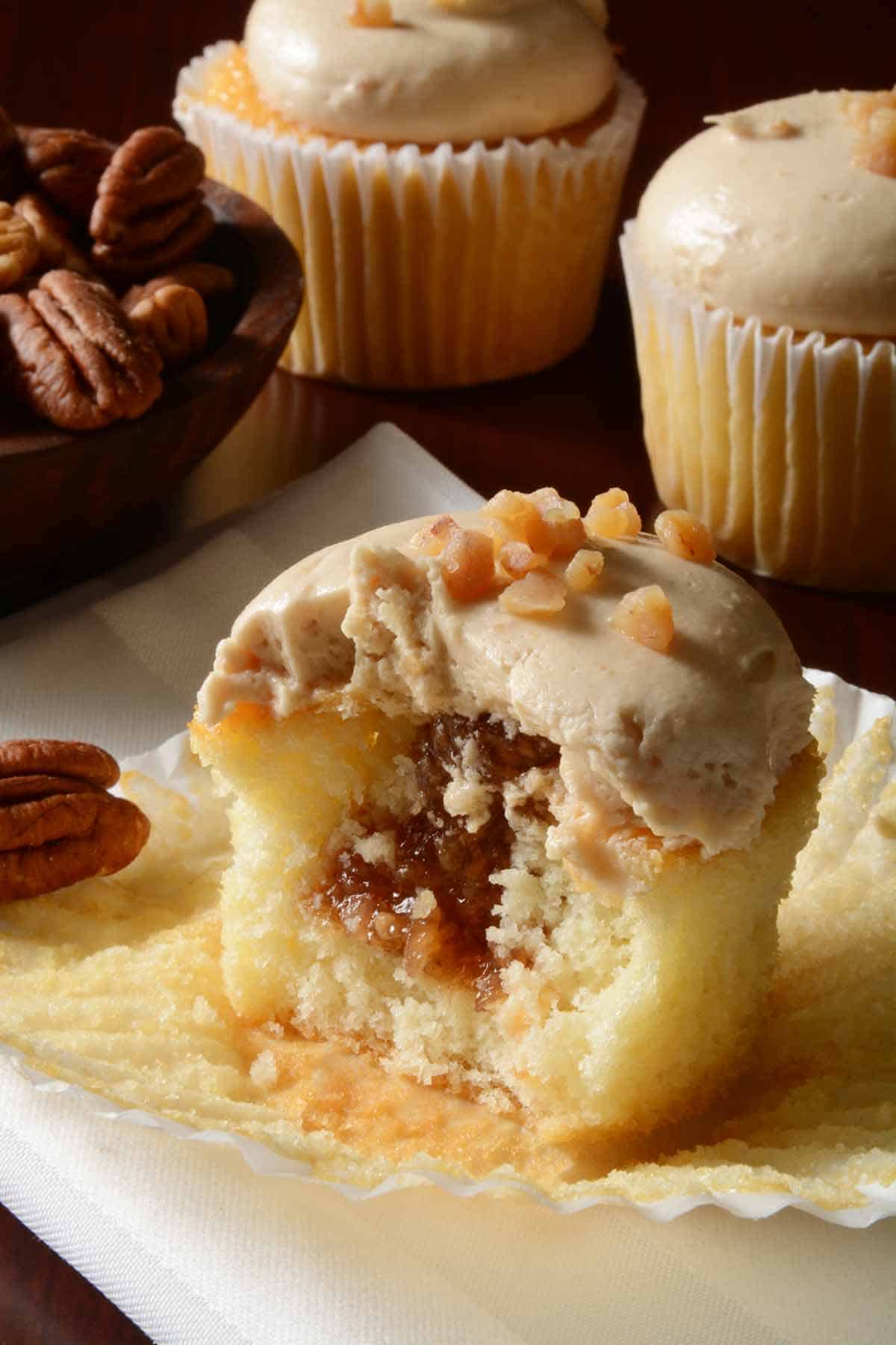 Lemon cupcake with cookie butter center and caramel frosting.