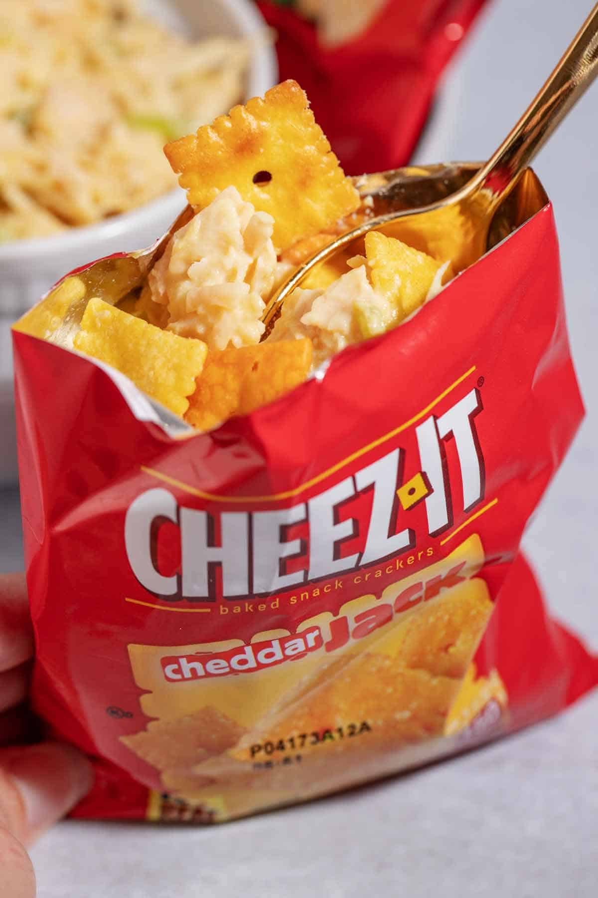 Individual snack bag of Cheez-It crackers with chicken salad inside. This makes walking chicken salad.