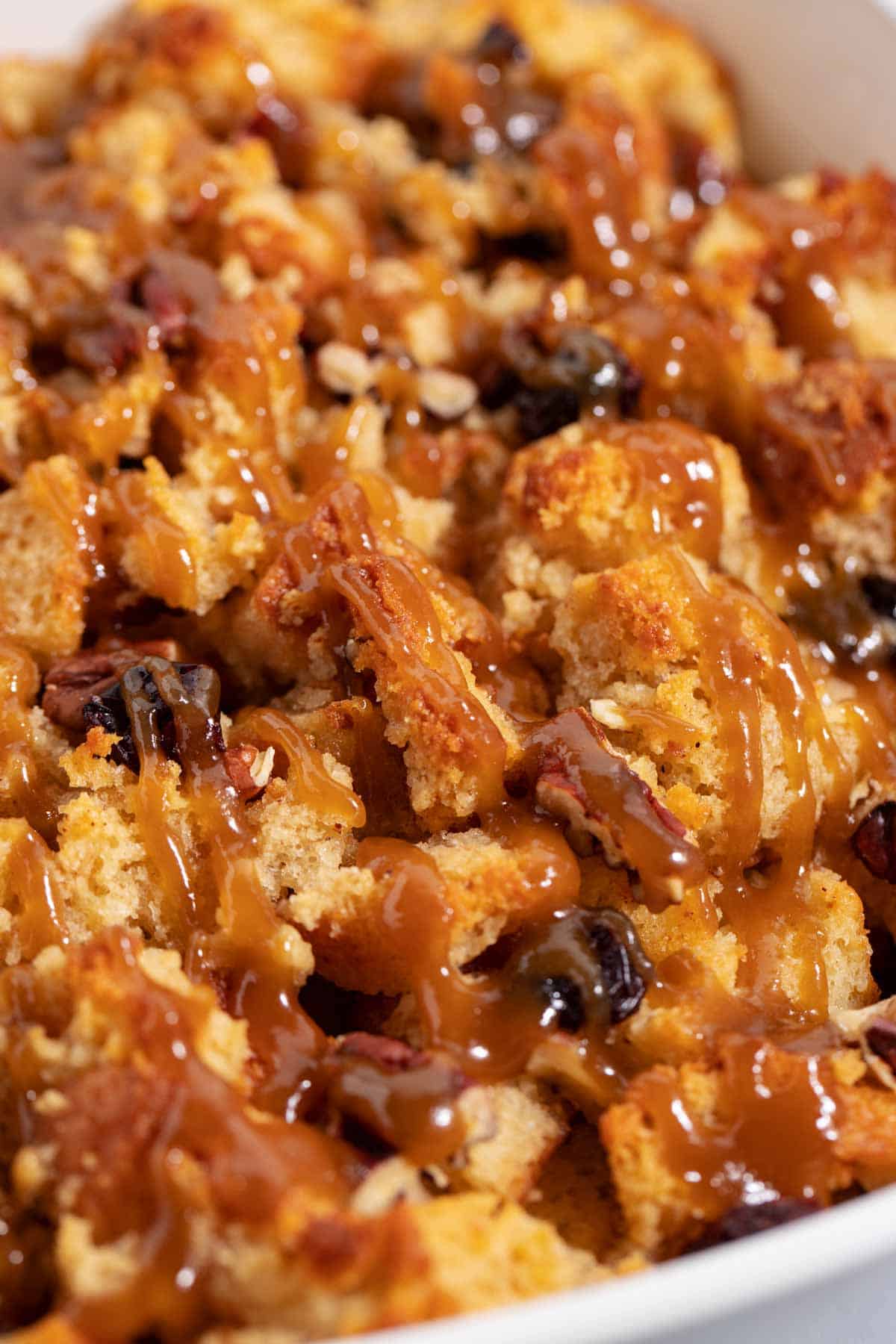 Closeup of leftover cake bread pudding with brown sugar caramel sauce.