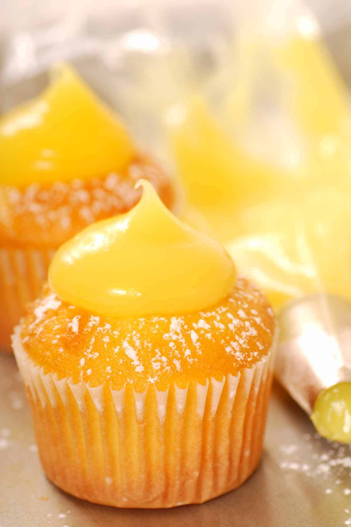 Lemon cupcakes filled and topped with lemon curd.