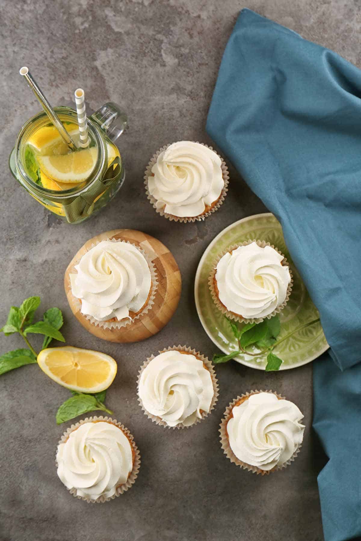 Lemon cupcakes filled and decorated with pastry cream.