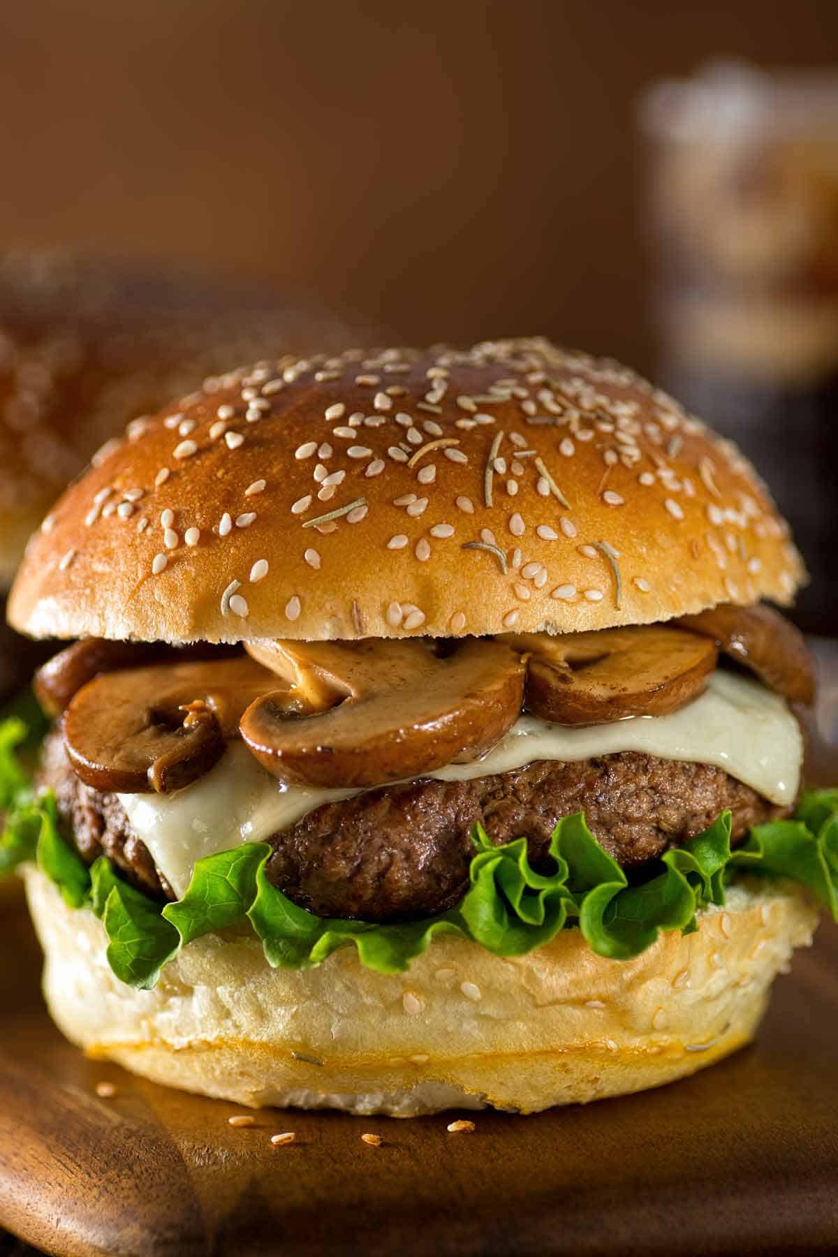 Mushroom Swiss burger served on a sesame seed bun.
