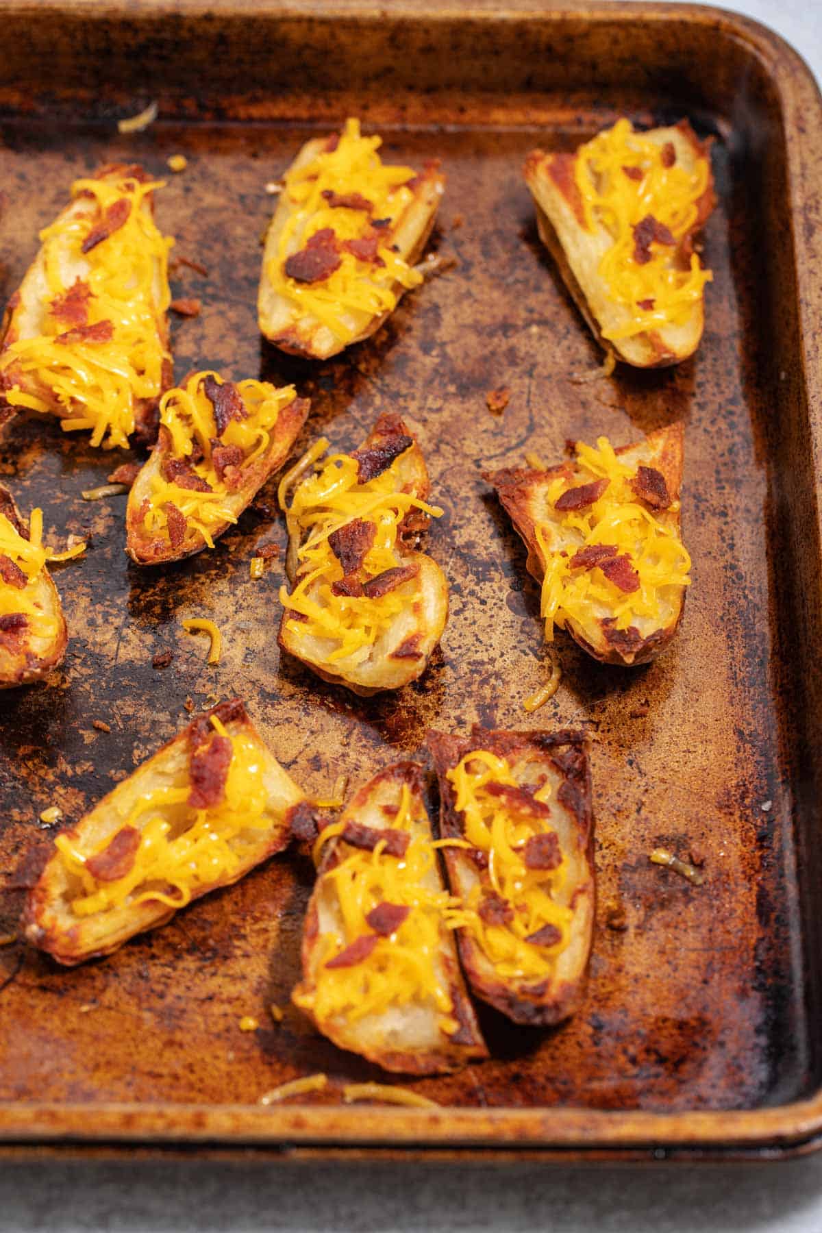 Baking tray of TGIF potato skins recipe going into the oven.