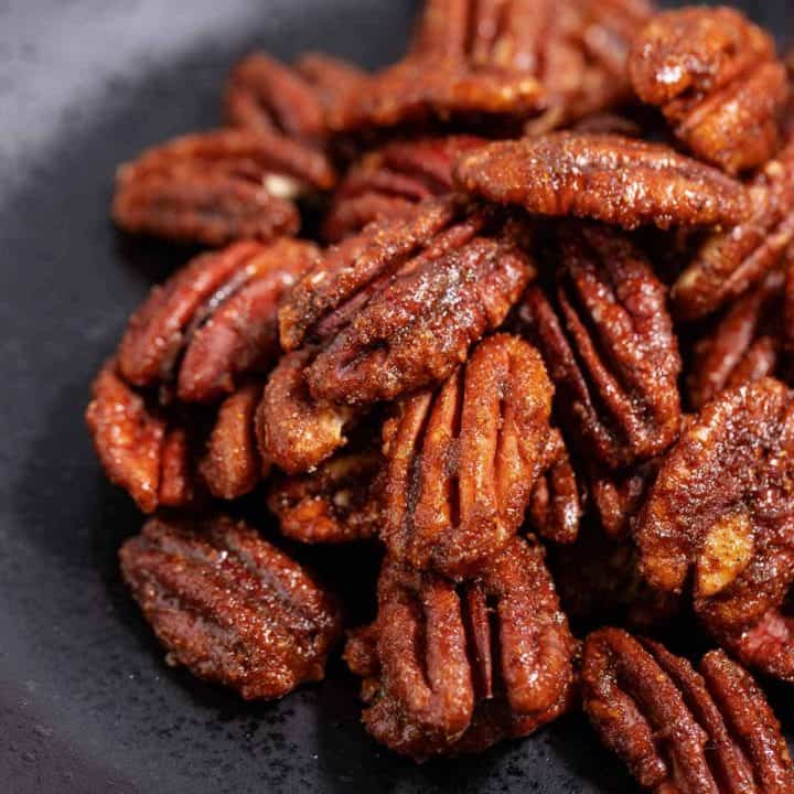 Pile of candied pecans made with copycat Trader Joe's sweet and spicy pecans recipe.
