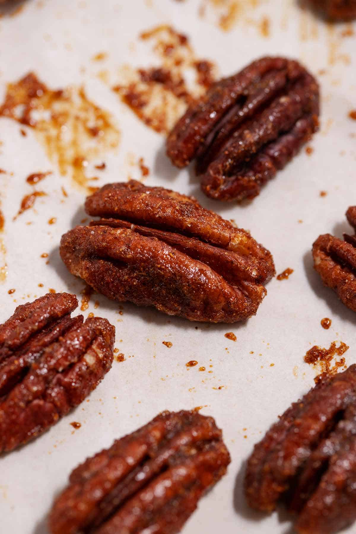 Close up of a toasted sweet and spicy candied pecan (like Trader Joe's).