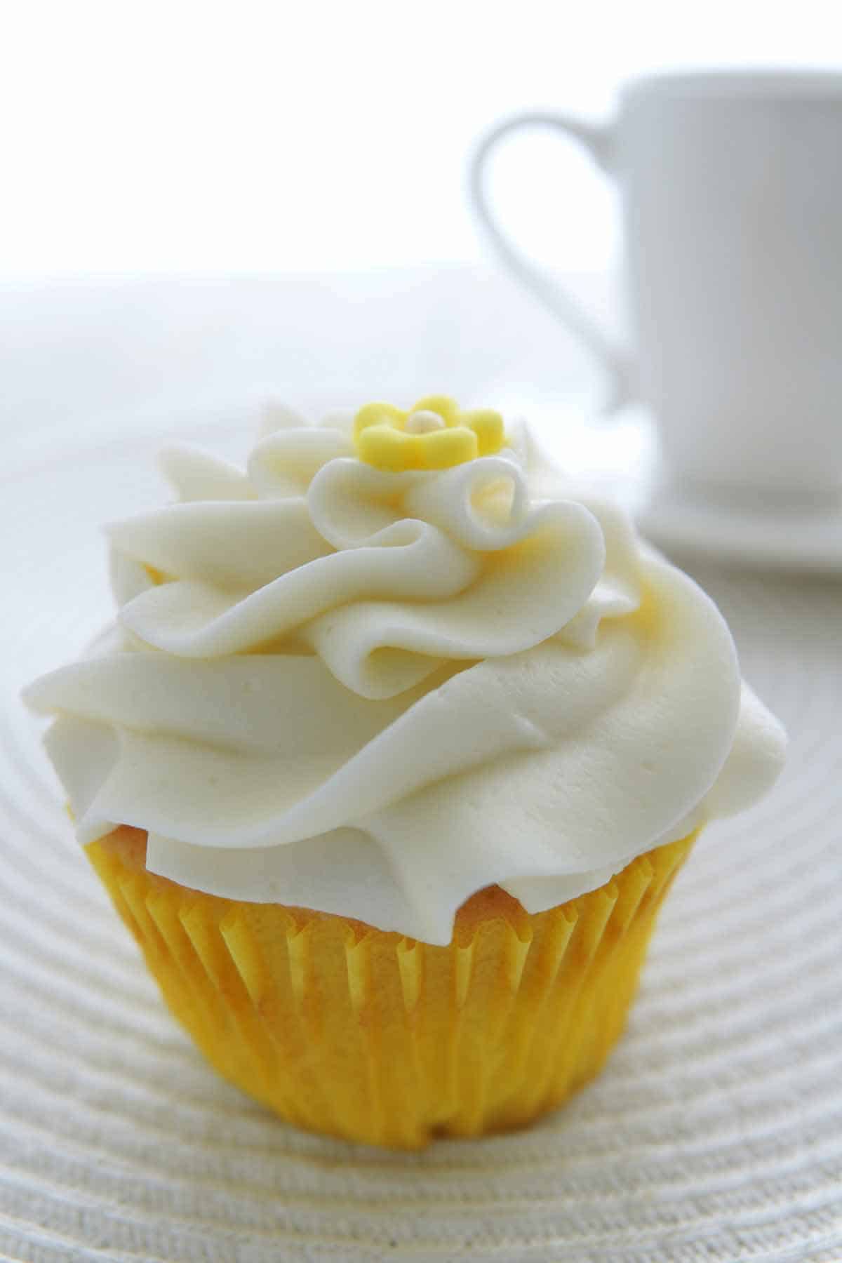 Lemon cupcake filled with whipped cream stabilized with vanilla instant pudding.