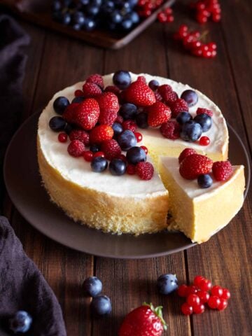 Cheesecake with mixed berries on top.