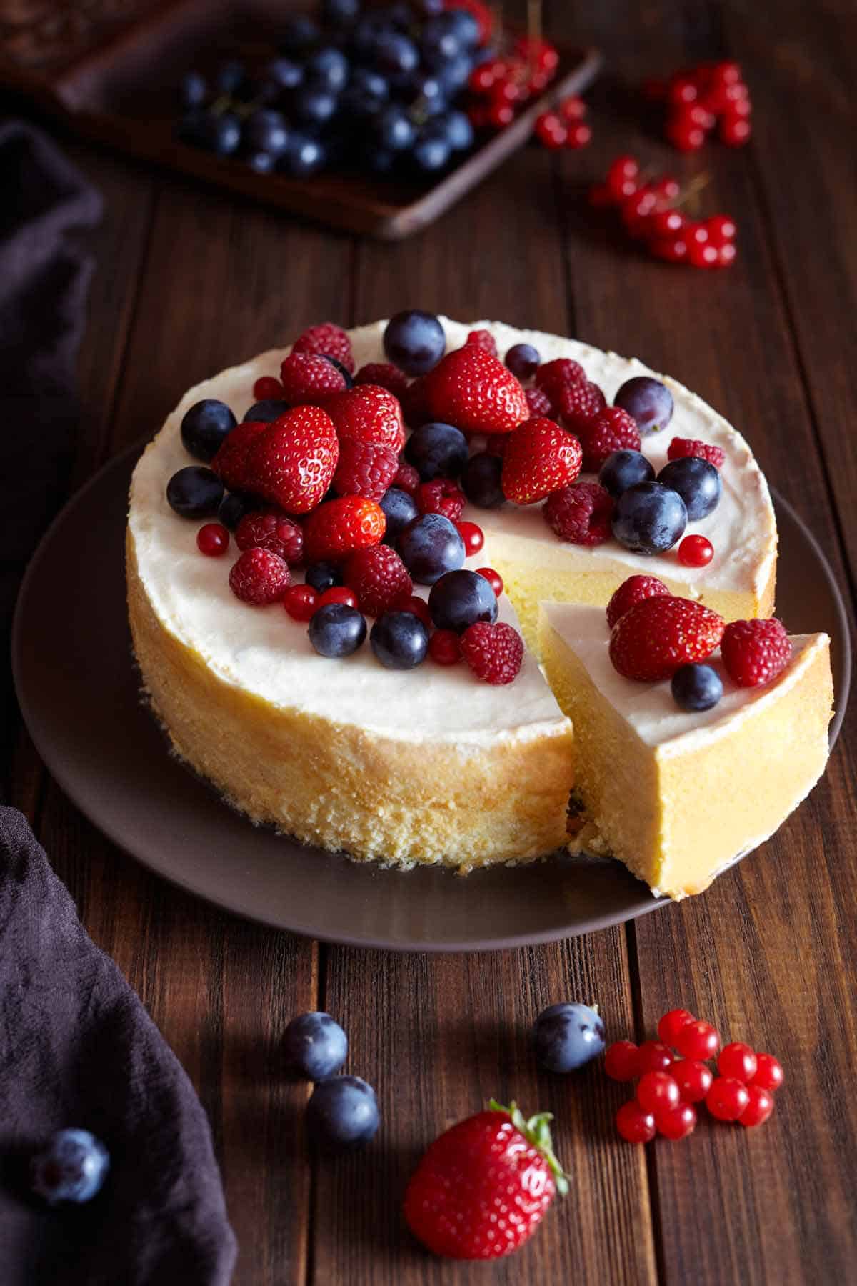 Cheesecake with mixed berries on top.